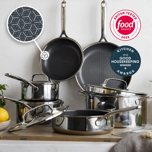 10-piece hybrid ceramic cookware set with glass lids on a counter, close-up shows the pan’s smooth cooking surface.