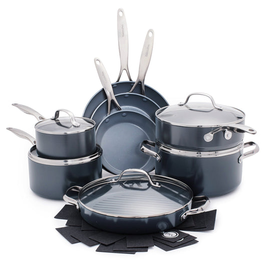 13-piece ceramic cookware set with assorted pots, pans, lids, and black felt pan protectors.
