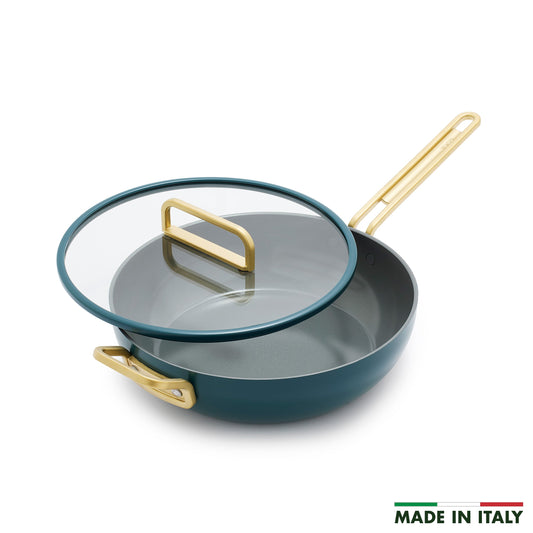 Ceramic nonstick 4.5-quart pan in Venetian teal with gold handles and a glass lid.