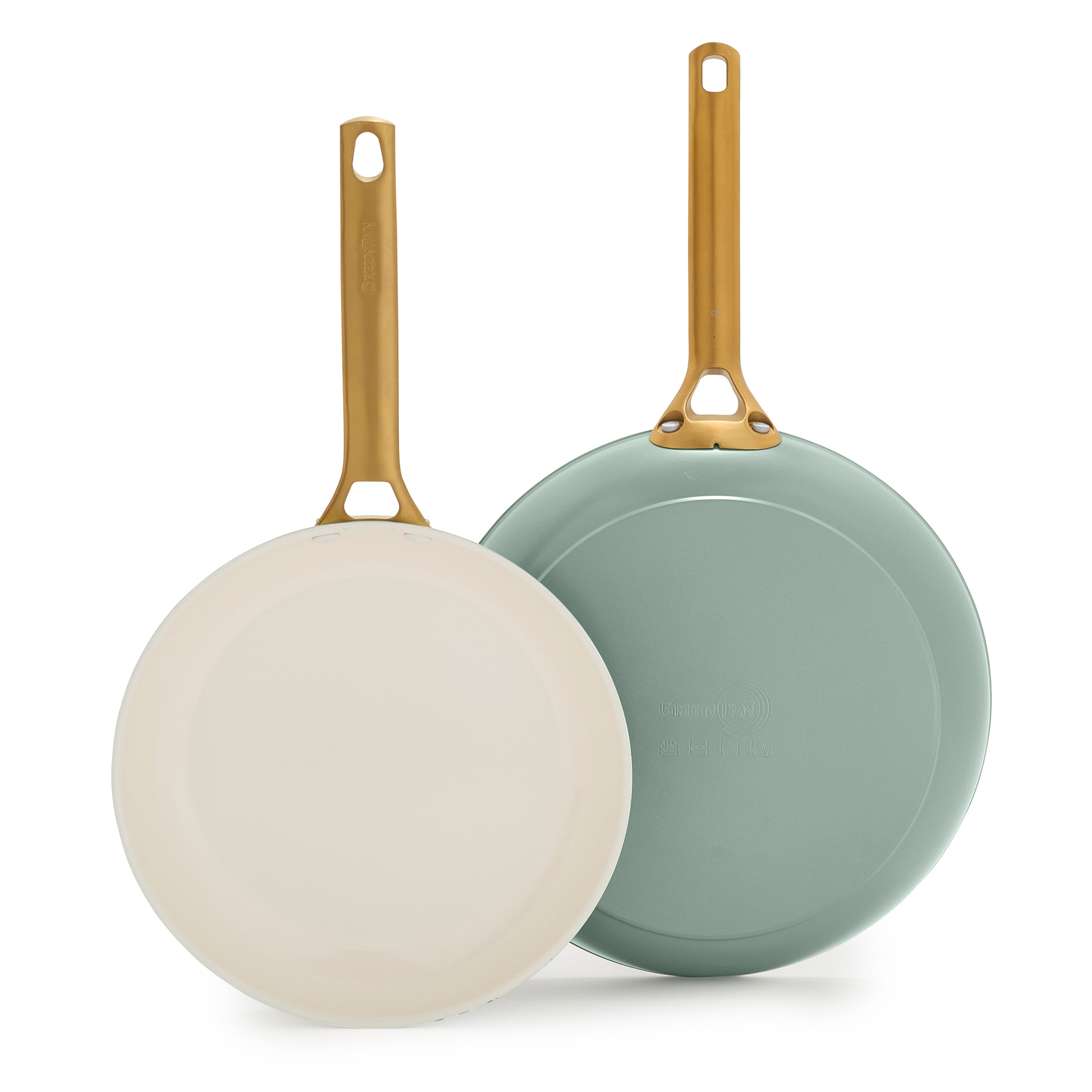 Two green frying pans with gold handles on a white background